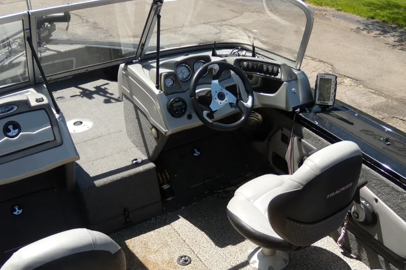 Slide: The Image of 2016 Tracker Targa V-18 WT boat interior with steering wheel and seating. - 5
