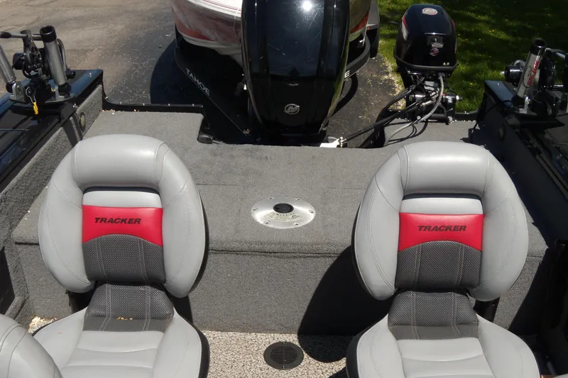 Slide: The Image of 2016 Tracker Targa V-18 WT boat interior with dual seats and motor view. - 8