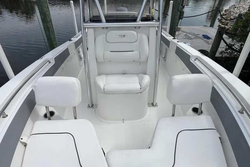 Slide: The Image of 2015 Sea Hunt Ultra 211 boat interior with white seating and stainless steel rails. - 3