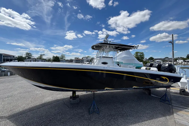 The Image of 2007 Fountain 34 Center Console boat on display under a clear blue sky. - 0