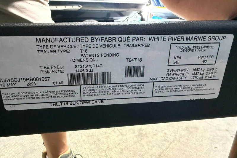 Slide: The Image of Label on 2024 Tahoe T18 trailer by White River Marine Group, showing specifications and compliance details. - 18