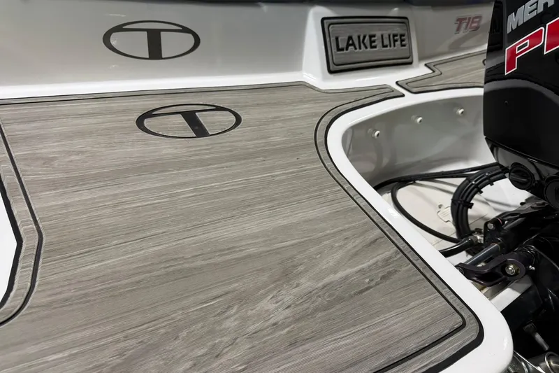 Slide: The Image of 2024 Tahoe T18 boat deck with "Lake Life" emblem and motor details. - 3