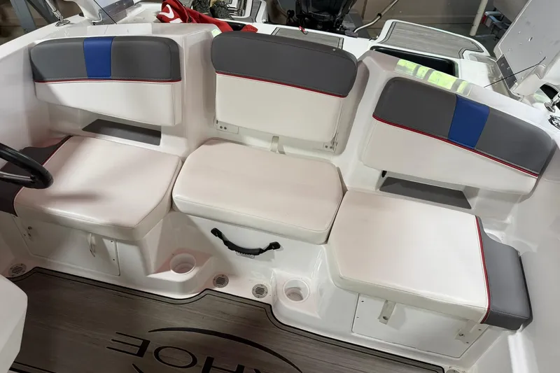 Slide: The Image of 2024 Tahoe T18 boat interior with cushioned seating and modern design. - 7