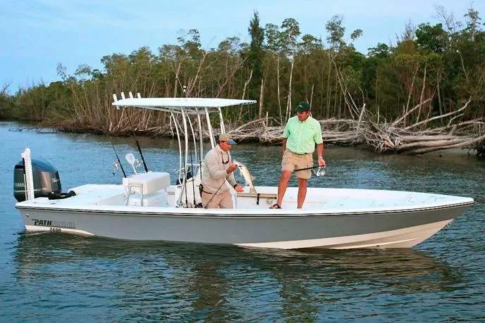 Slide: The Image of Manufacturer Provided Image: 2017 Pathfinder 2400 TRS boat with two people fishing in a scenic river. - 5