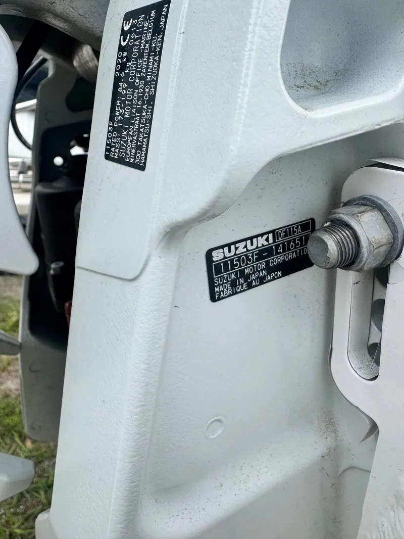 Slide: The Image of Close-up of Suzuki DF115A outboard motor on a Carolina Skiff 19 LS. - 12