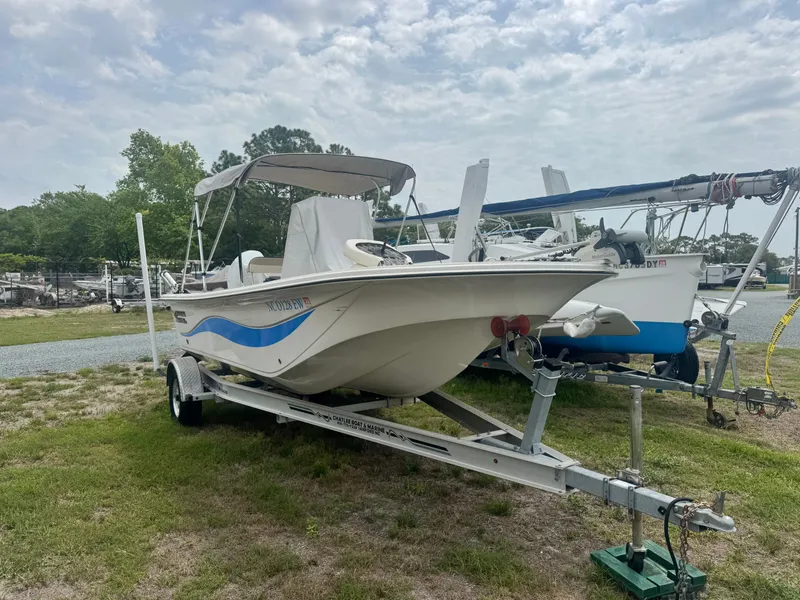 Slide: The Image of 2022 Carolina Skiff 19 LS boat on trailer outdoors. - 2