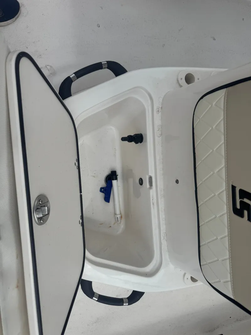 Slide: The Image of Interior of a 2022 Carolina Skiff 19 LS boat with storage compartment. - 9