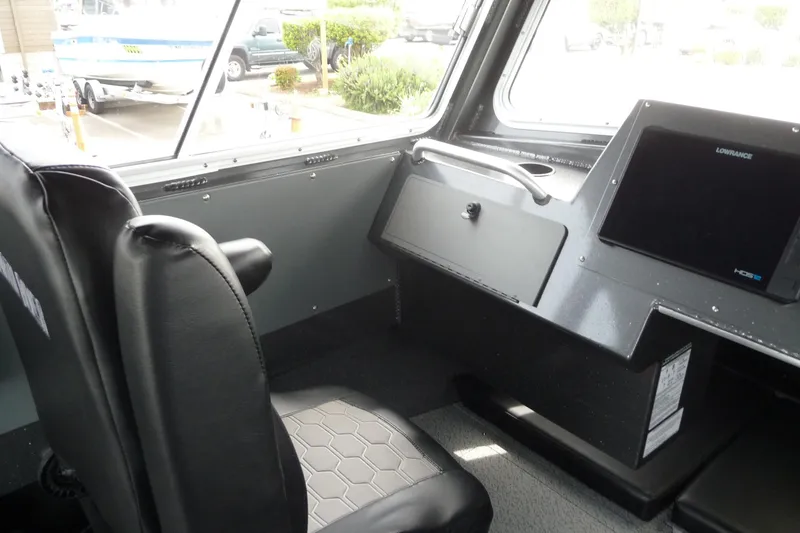 Slide: The Image of Interior of 2025 North River 2700s boat with navigation equipment and seating. - 13