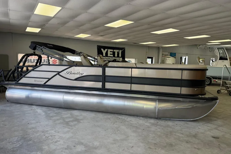 The Image of 2026 Bentley Pontoons Legacy 223 Swingback in showroom, showcasing sleek design and modern features. - 1
