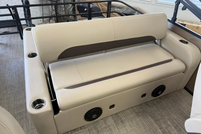 Slide: The Image of 2026 Bentley Pontoons Legacy 223 Swingback interior seating with cup holders and speakers. - 10
