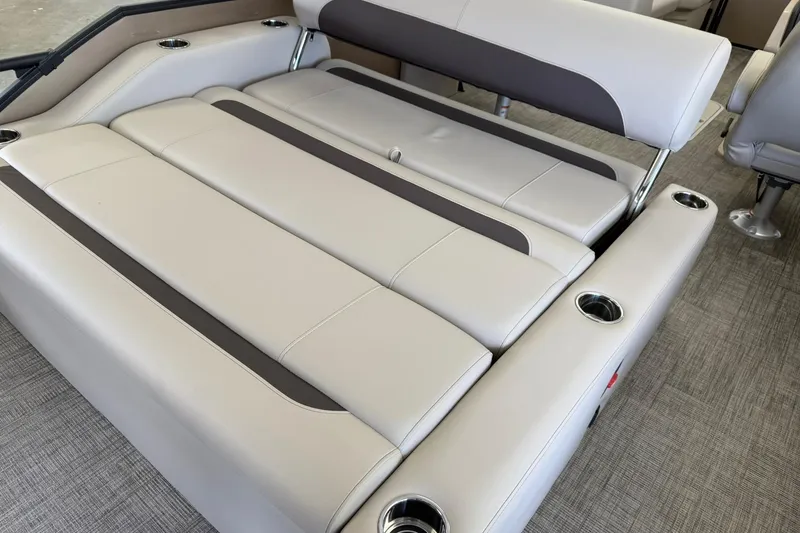 Slide: The Image of 2026 Bentley Pontoons Legacy 223 Swingback interior with luxurious seating and cup holders. - 11