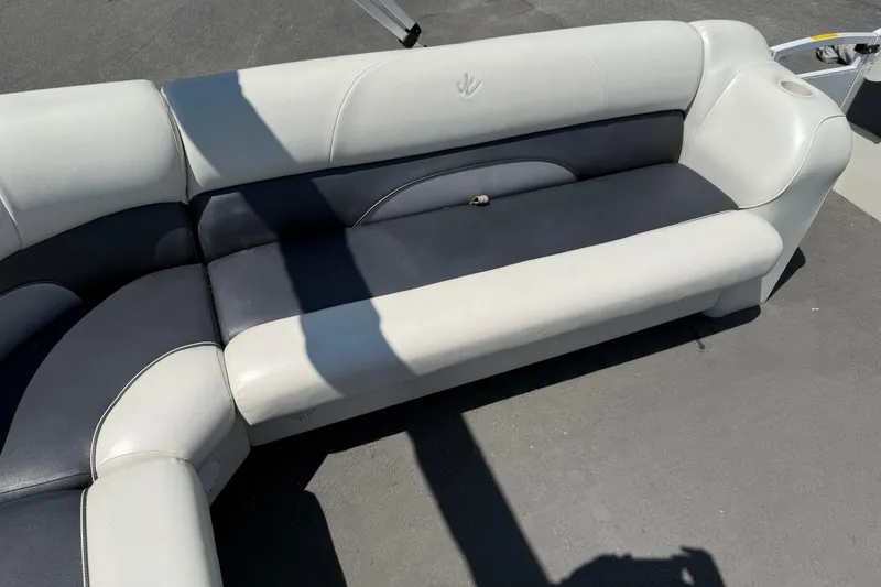 Slide: The Image of White and gray seating on 2010 JC 21 Neptoon boat, outdoor setting. - 16