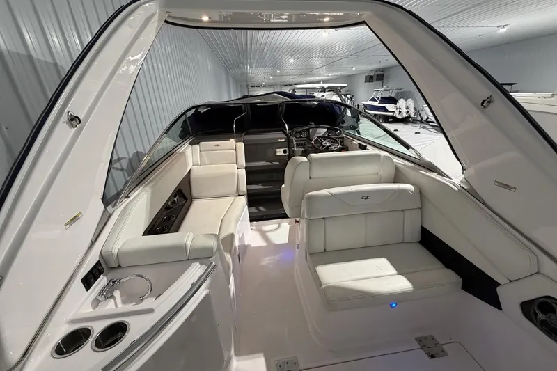 Slide: The Image of Interior view of a 2012 Regal 28 Express boat, showcasing seating and dashboard. - 11