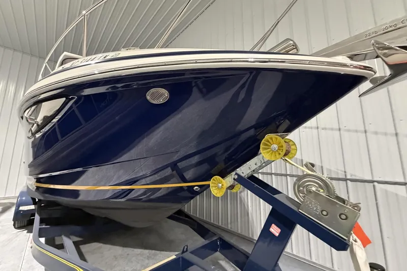 Slide: The Image of 2012 Regal 28 Express boat on trailer in indoor storage facility. - 6