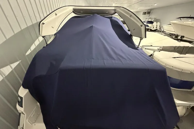Slide: The Image of Covered 2012 Regal 28 Express boat in indoor storage facility. - 9