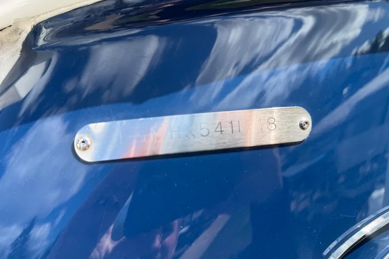 Slide: The Image of Metallic identification plate on a 2018 Regal 28 Express boat hull. - 7