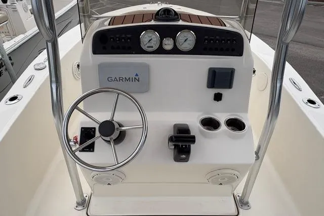 Slide: The Image of 2020 Pioneer 180 Islander boat console with Garmin navigation and steering wheel. - 4