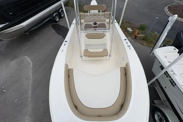Slide: The Image of 2020 Pioneer 180 Islander boat with beige seating and center console. - 7