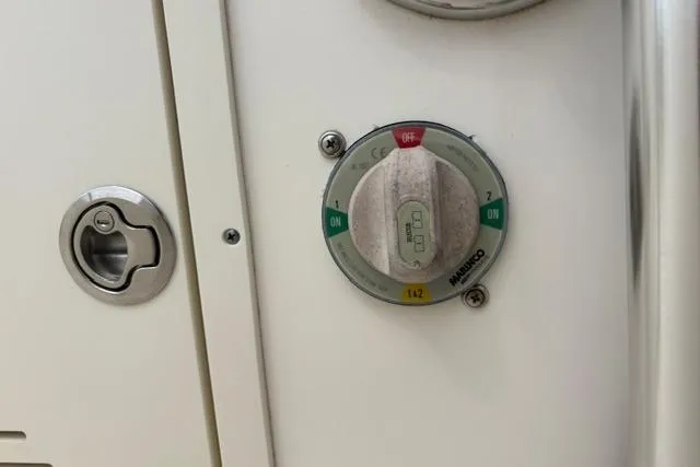 Slide: The Image of Battery switch on a 2020 Pioneer 180 Islander boat, showing "ON" and "OFF" positions. - 9