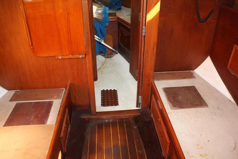 Slide: The Image of Interior of 1983 Cape Dory 27 sailboat with wooden finishes and compact layout. - 26