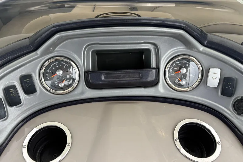 Slide: The Image of Dashboard of 2023 Sun Tracker Party Barge 22 DLX with gauges and controls. - 14