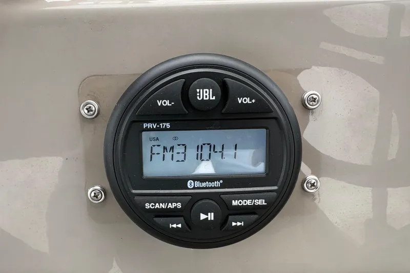Slide: The Image of JBL PRV-175 radio on 2023 Sun Tracker Party Barge 22 DLX, displaying FM 104.1. - 15