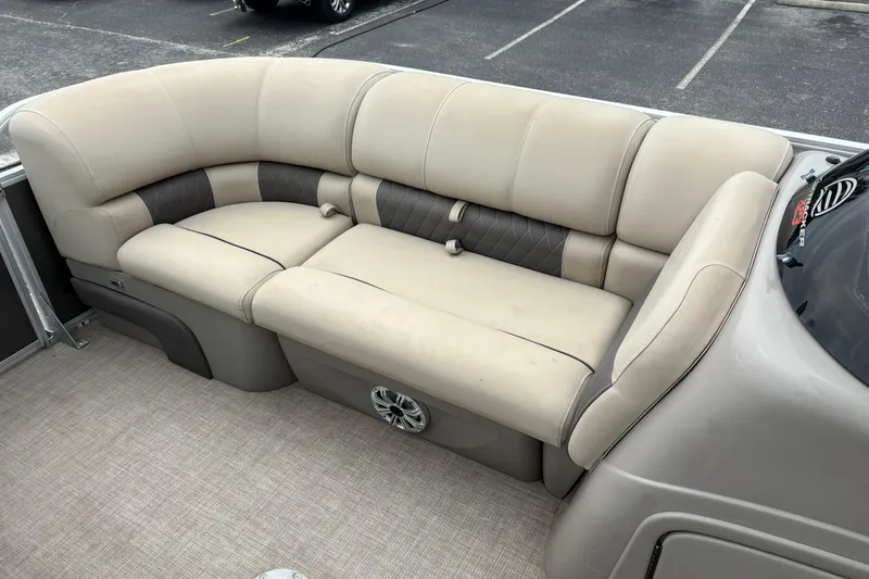Slide: The Image of 2023 Sun Tracker Party Barge 22 DLX interior seating, beige upholstery, spacious and comfortable. - 17