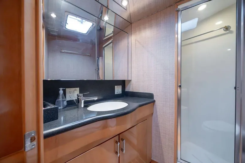 Slide: The Image of Luxurious bathroom in 2003 Hatteras 60 Convertible yacht with modern fixtures and shower. - 10