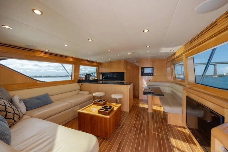 Slide: The Image of Luxurious interior of 2003 Hatteras 60 Convertible yacht with elegant wood finishes. - 13