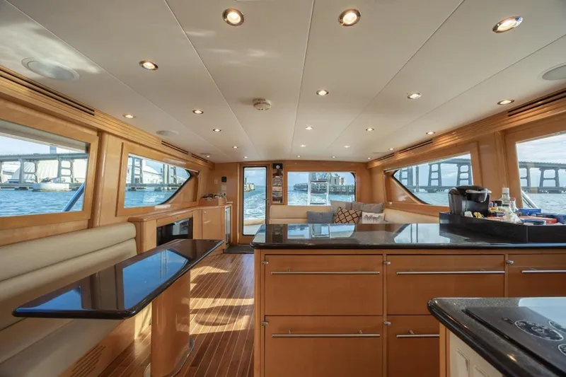Slide: The Image of Luxurious interior of 2003 Hatteras 60 Convertible yacht with modern amenities and scenic views. - 14