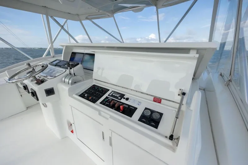 Slide: The Image of Control panel of a 2003 Hatteras 60 Convertible yacht with ocean view. - 16