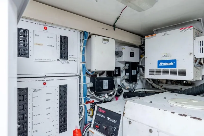 Slide: The Image of Electrical control panel and equipment in a 2003 Hatteras 60 Convertible yacht. - 20