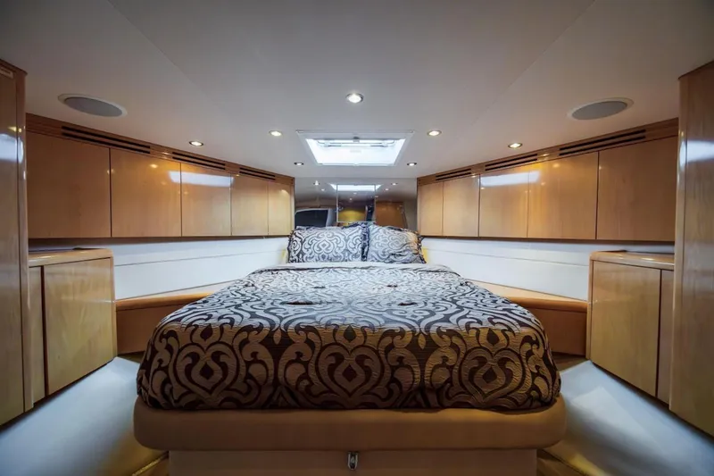 Slide: The Image of Luxurious bedroom interior of 2003 Hatteras 60 Convertible yacht with elegant wood cabinetry. - 7