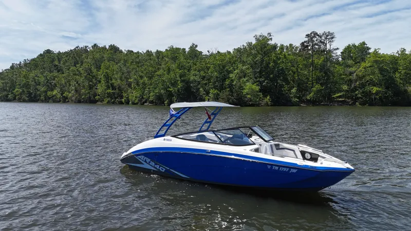 Slide: The Image of 2020 Yamaha Bow Rider boat on a calm lake. - 4