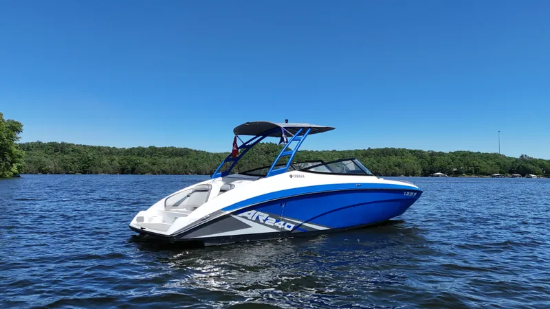 Slide: The Image of 2020 Yamaha Bow Rider boat on a calm lake. - 6
