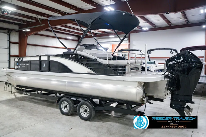 Slide: The Image of 2022 Bennington 23 LTSB pontoon boat with Mercury engine in showroom. - 10