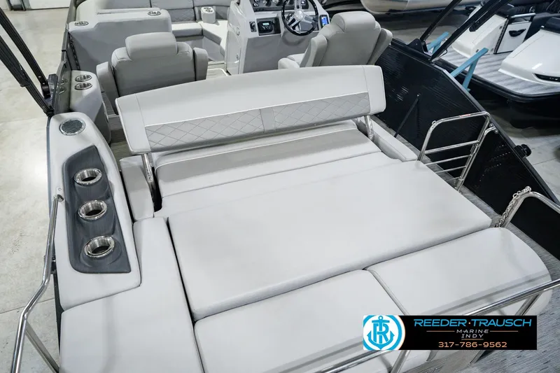 Slide: The Image of 2022 Bennington 23 LTSB boat interior with plush seating and cup holders. - 17