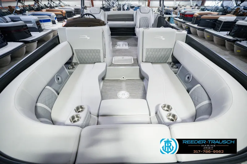 Slide: The Image of Luxurious interior of 2022 Bennington 23 LTSB pontoon boat with plush seating and cup holders. - 18