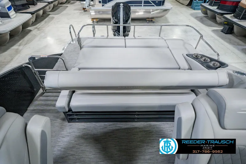 Slide: The Image of 2022 Bennington 23 LTSB pontoon boat with spacious seating and cup holders. - 21