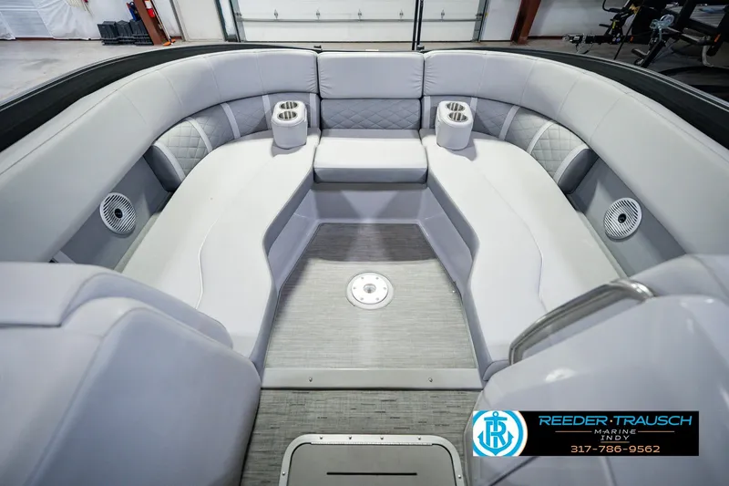 Slide: The Image of Interior of 2022 Bennington 23 LTSB pontoon boat with plush seating and cup holders. - 25