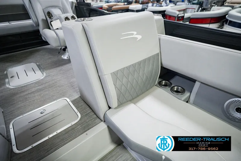 Slide: The Image of 2022 Bennington 23 LTSB boat interior with gray seating and cup holders. - 26
