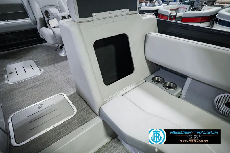 Slide: The Image of Interior of 2022 Bennington 23 LTSB boat with seating and cup holders. - 28