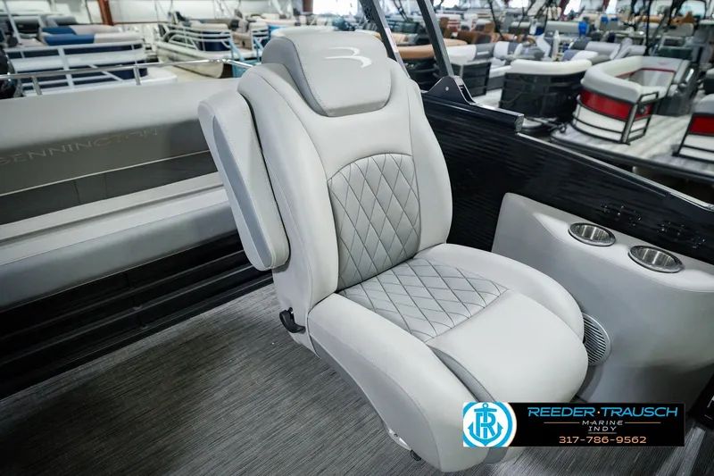 Slide: The Image of Luxurious seating on a 2022 Bennington 23 LTSB pontoon boat, featuring diamond-stitched upholstery. - 29