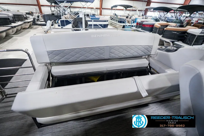 Slide: The Image of 2022 Bennington 23 LTSB pontoon boat interior with storage compartment open. - 33