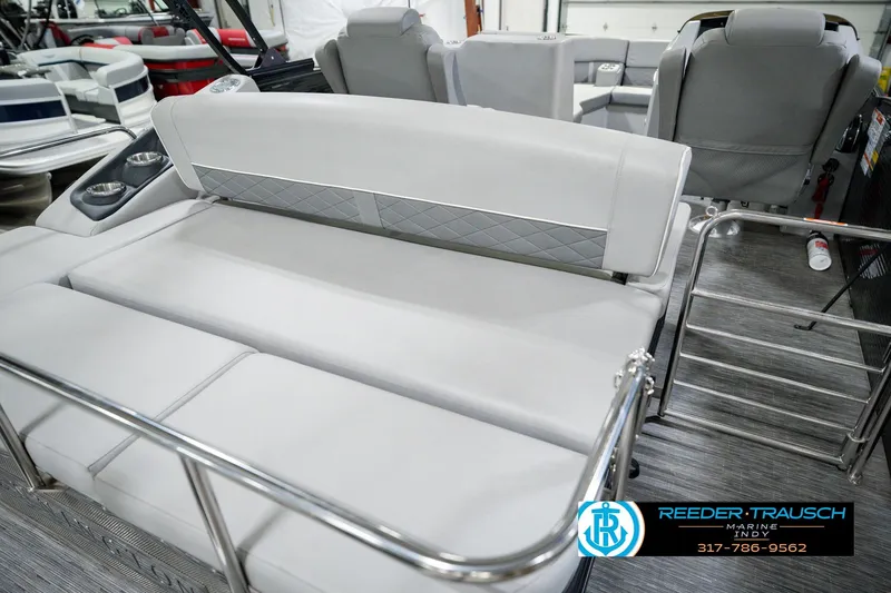 Slide: The Image of Interior of 2022 Bennington 23 LTSB pontoon boat with gray seating and cup holders. - 34