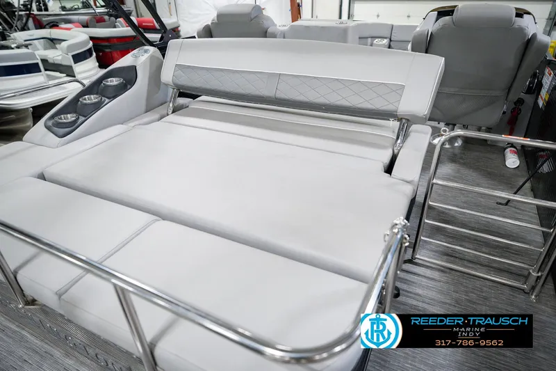 Slide: The Image of 2022 Bennington 23 LTSB boat interior with plush seating and cup holders. - 35