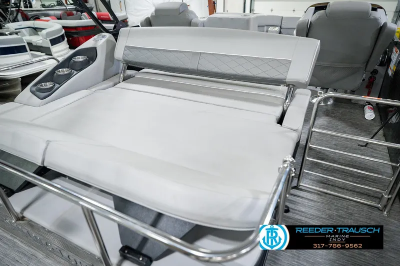 Slide: The Image of 2022 Bennington 23 LTSB boat interior with plush seating and cup holders. - 36