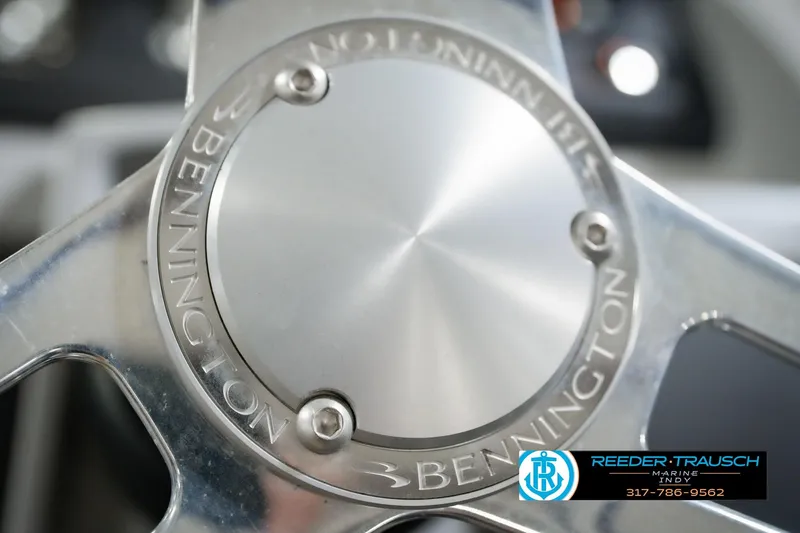Slide: The Image of Close-up of 2022 Bennington 23 LTSB steering wheel with logo and branding. - 40