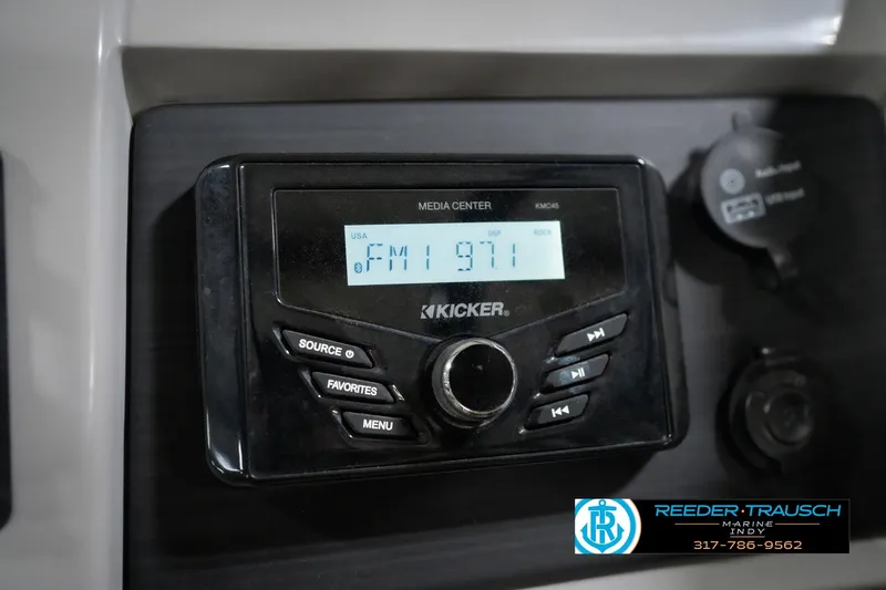 Slide: The Image of Kicker media center in 2022 Bennington 23 LTSB boat, displaying FM 97.1 station. - 42