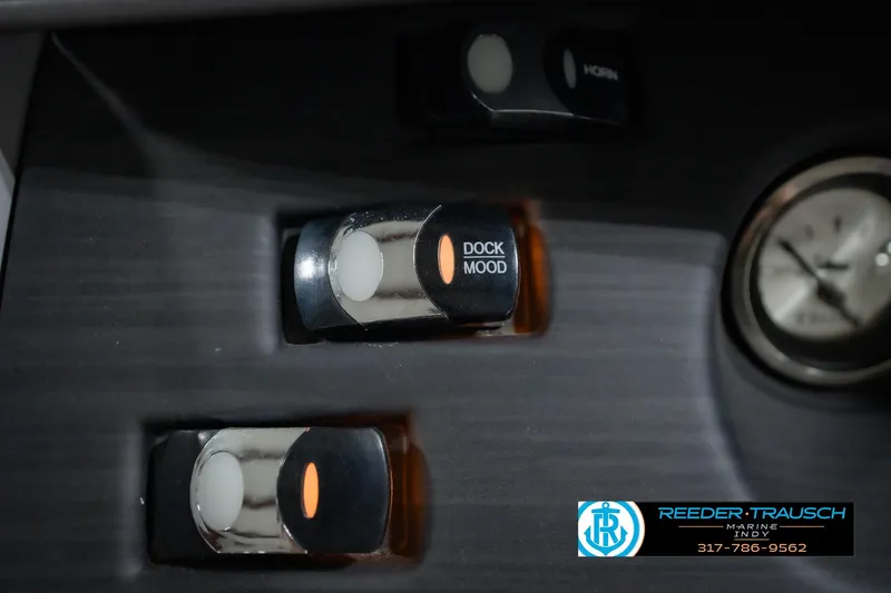 Slide: The Image of Control panel of 2022 Bennington 23 LTSB with dock mood switch and clock. - 43